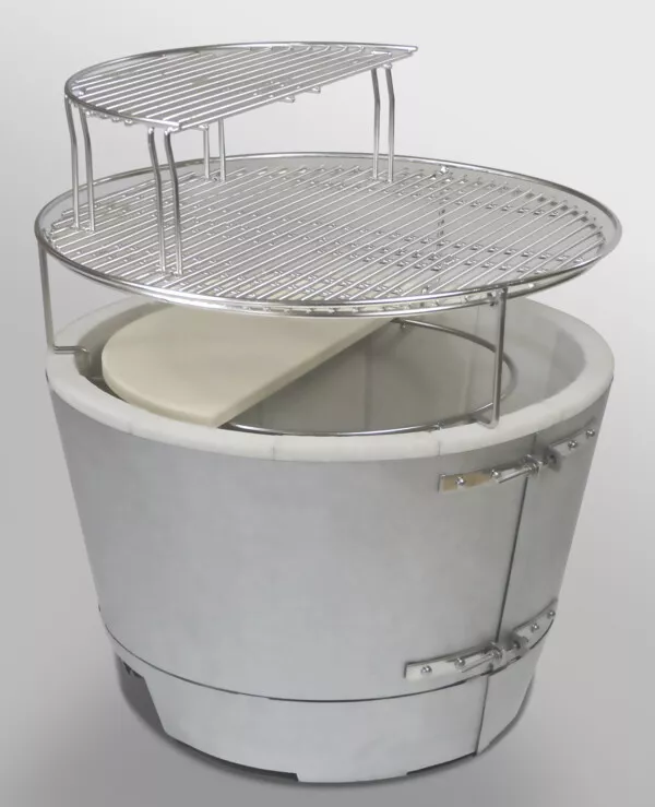 Kamado Gourmet's Forge Fire Chamber firebox is shown with our Two-Piece Heat Deflector, Cooking Grid, and Half Secondary Cooking Grid on top