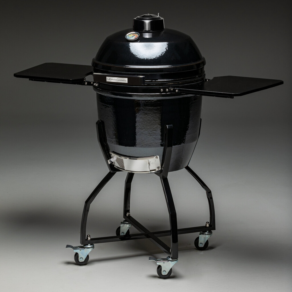 The black-colored Black Pepper Kamado Gourmet is shown with black bamboo side shelves, and a black cart.